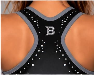 Detail of the rhinestone B logo between the shoulder straps